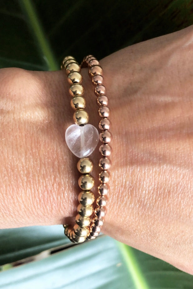 Gold Beaded Bracelet with rose quartz Heart Charm layered with a rose gold beaded bracelet handmade at RM Kandy